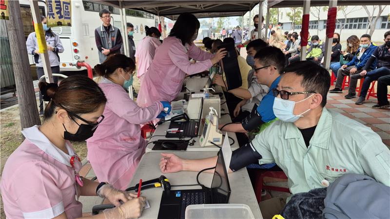Donors actively participate, lining up for verification and blood donation registration.